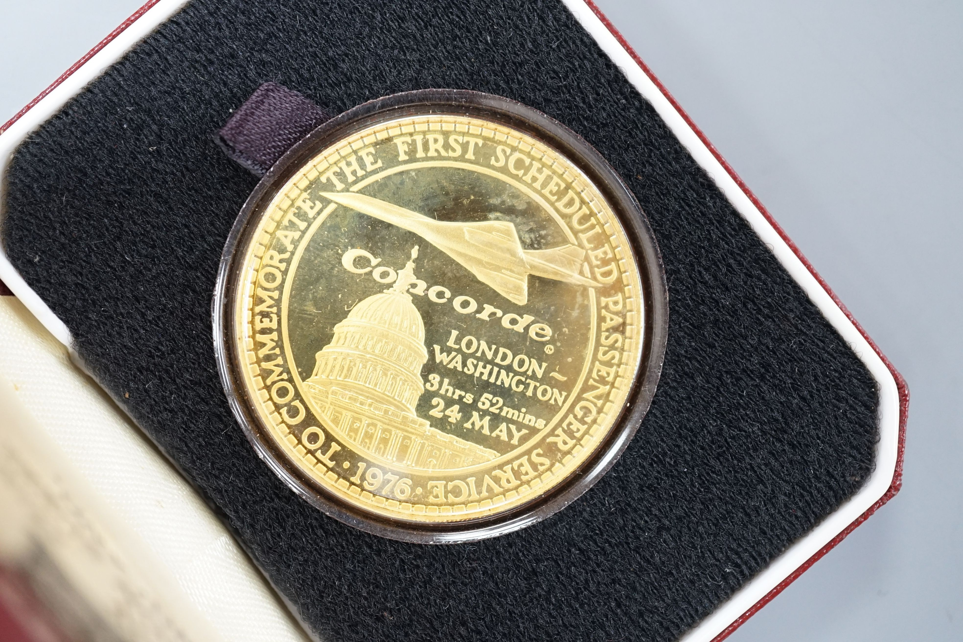 Five assorted cased Pobjoy Mint silver gilt Crown medals struck to commemorate first flights of Concorde, with certificates